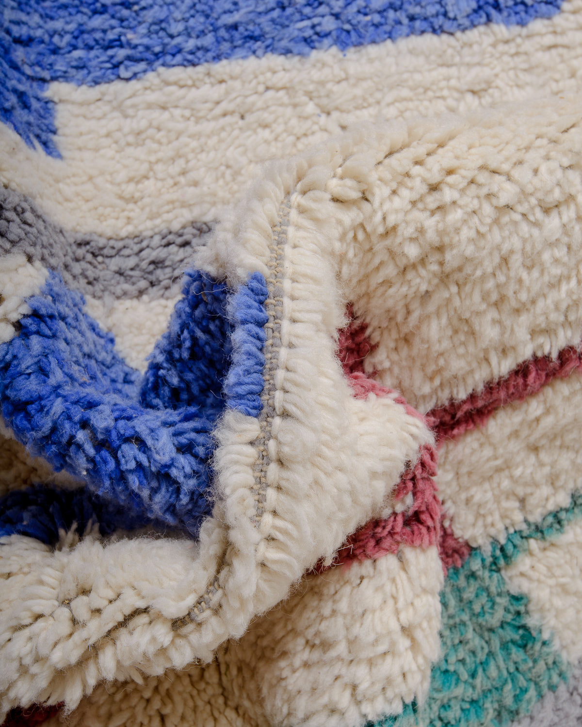 Modern, designer, handcrafted Berber rug from Morocco. Beniourain carpet with beautiful colours and patterns and fluffy wool texture.